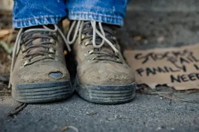 A closeup of a person's worn boats.