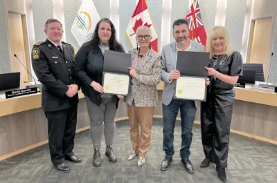 Essex-Windsor EMS Deputy Chief Ryan Lemay and Warden Hilda MacDonald presents certificates to representatives of Erie James Produce and the Leamington Regional Food Hub at the March 5, 2025, Essex County Council meeting.