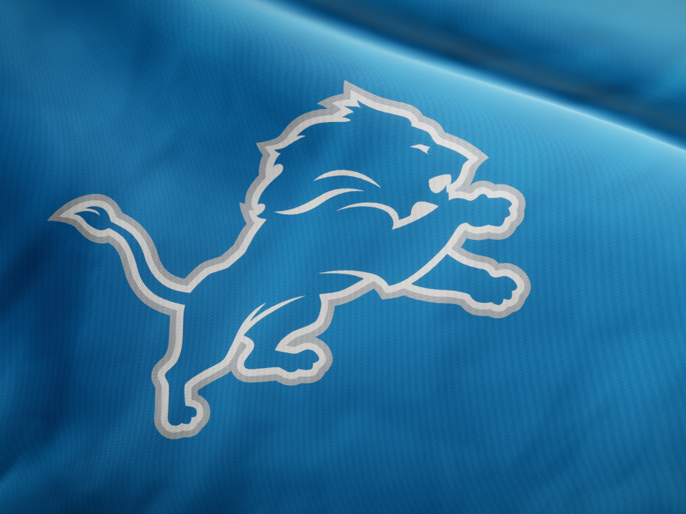 The Detroit Lions logo on a blue jersey